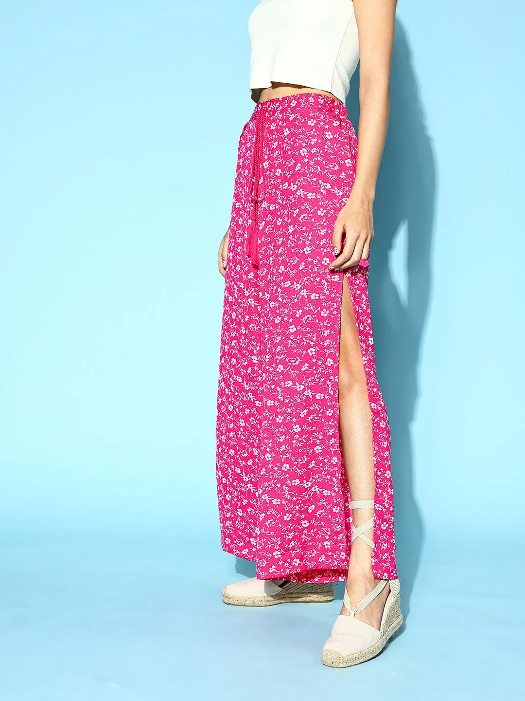 Berrylush Women Pink & White Floral Printed Mid-Rise Tie-Up Waist Side-Slit Tapered Regular Trousers