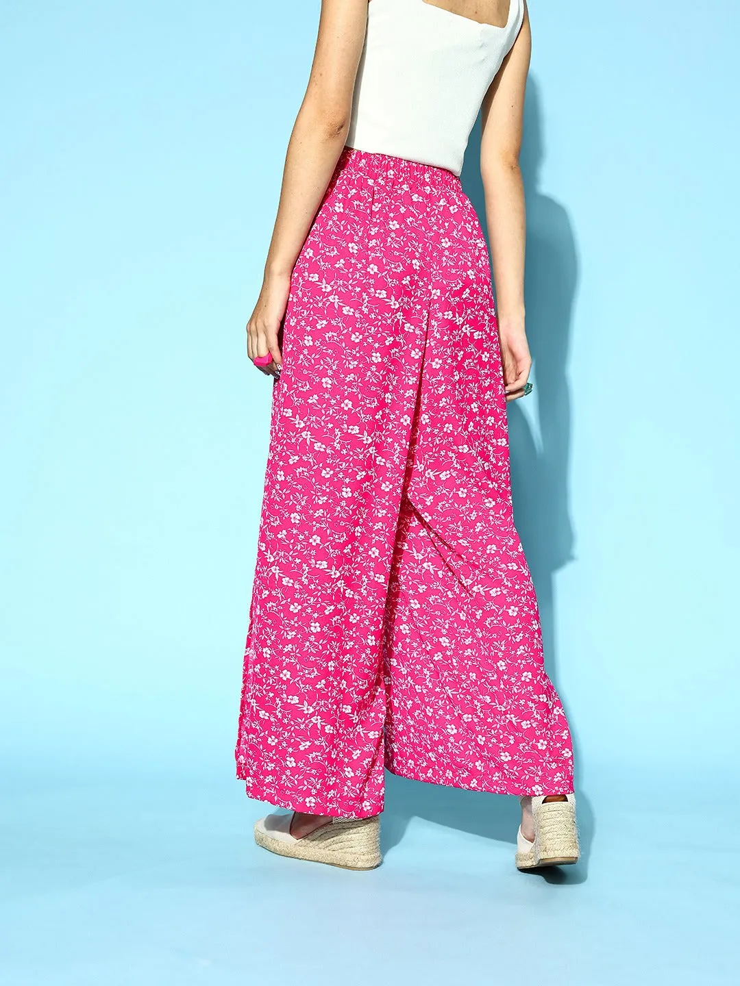 Berrylush Women Pink & White Floral Printed Mid-Rise Tie-Up Waist Side-Slit Tapered Regular Trousers